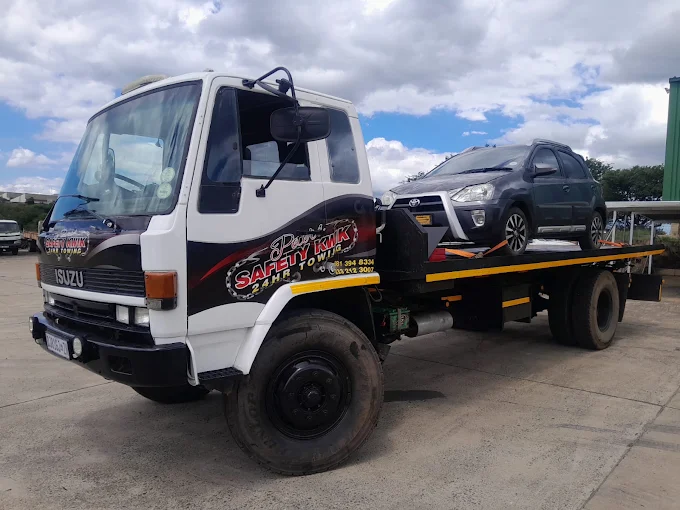 Peters Safety Kwik Isuzu flatbed tow truck providing 24HR towing in Richmond